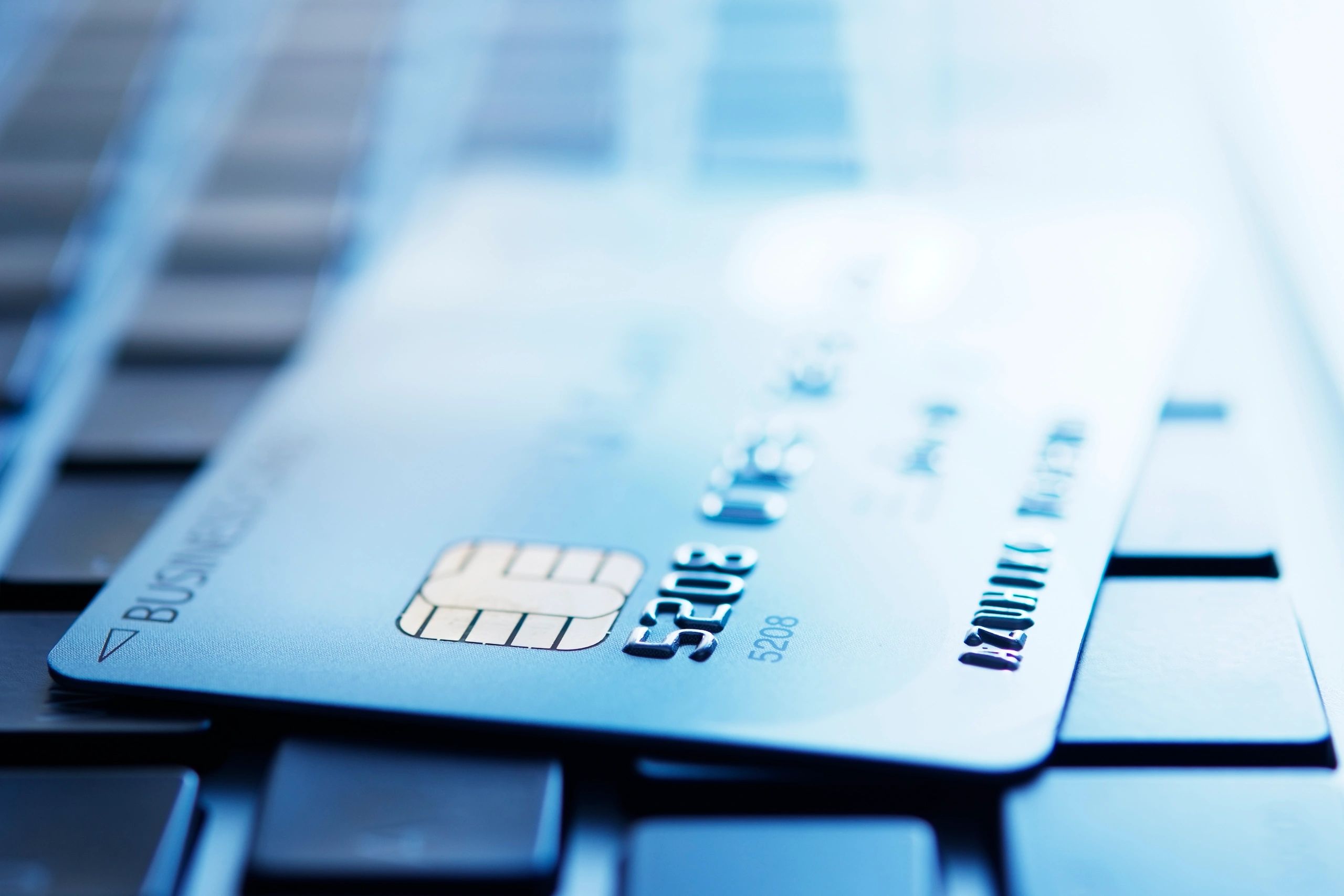 Credit card on laptop representing subscription billing management